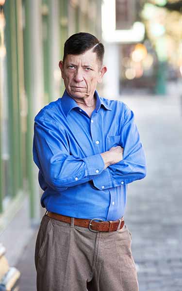 angry man with folded arms