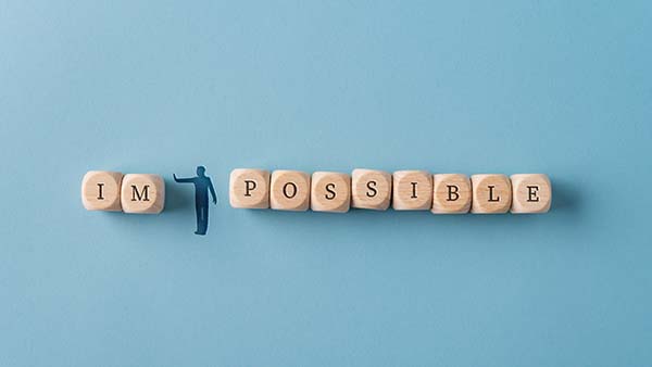 silhouetted man figure pushing away letters