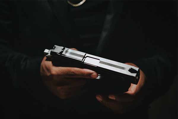 hand holding pistol thumbnail