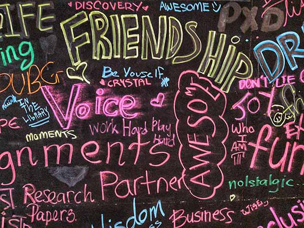 multicolored graffiti on an old concrete wall