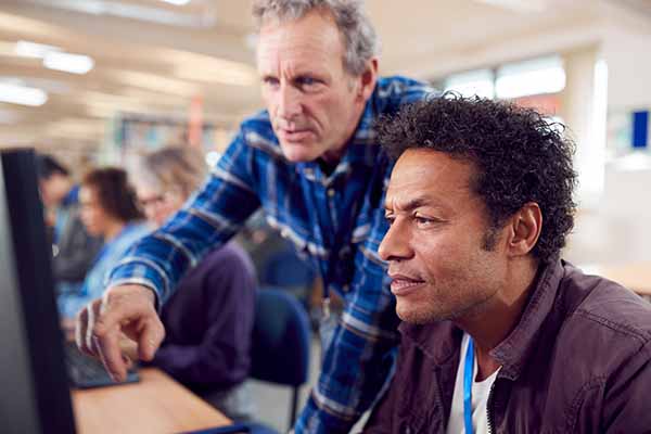 teacher with group of mature adult students