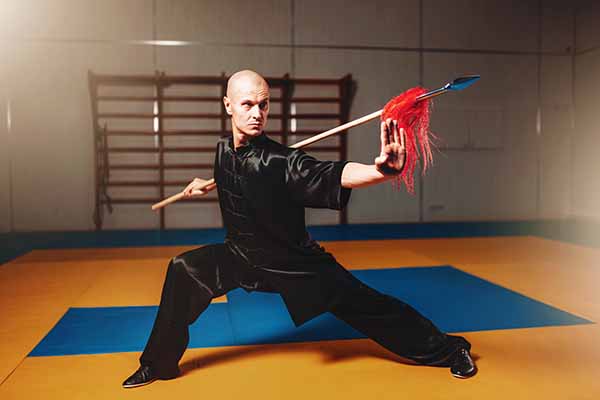 wushu master training with spear martial arts